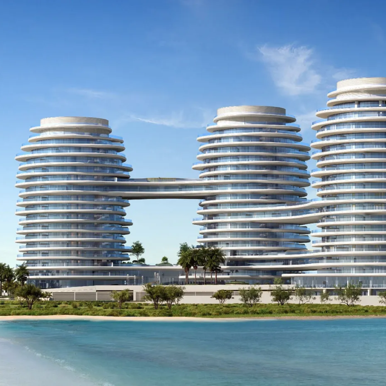Modern beachfront apartments with palm trees.