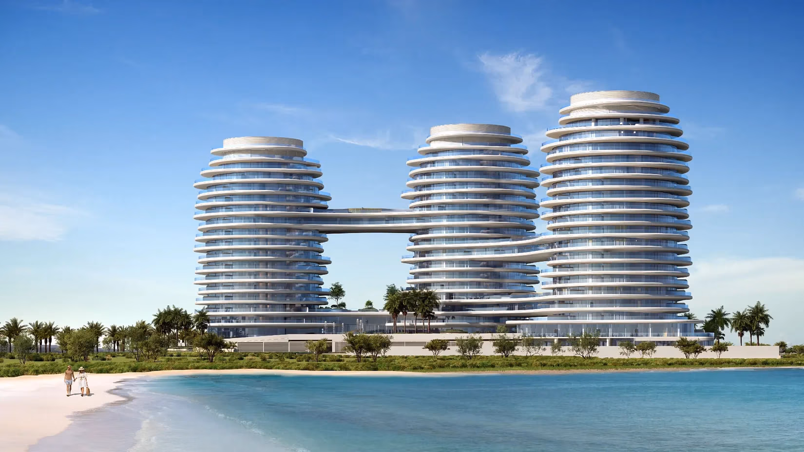 Modern beachfront apartments with palm trees.