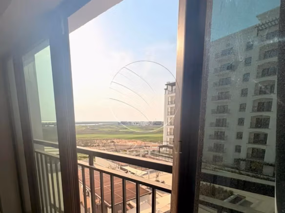 Studio mid floor + Partial Golf View and Community