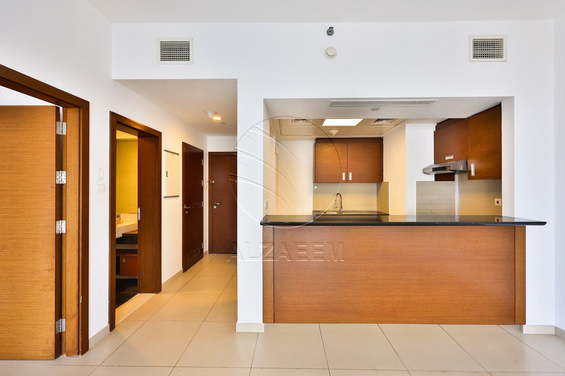 Lower Floor Unit | VACANT | Road View
