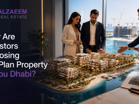 Investors reviewing an off-plan waterfront development model with a real estate advisor in Abu Dhabi.